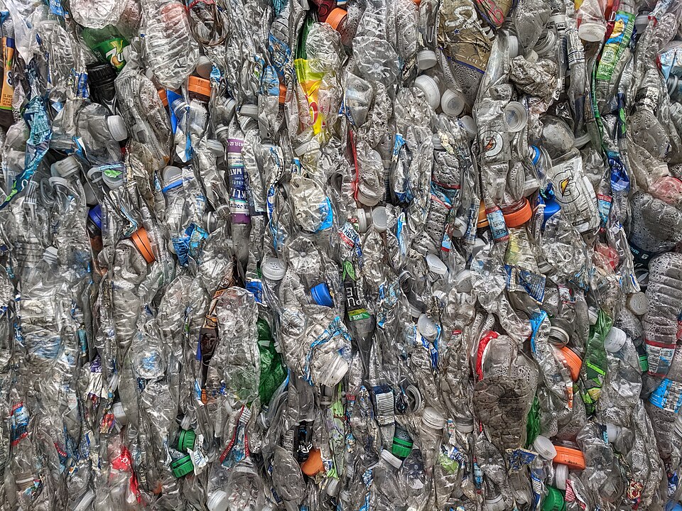 Baled PET bottles prepared for recycling, relevant to microplastics and recycling sorting by FTIR.